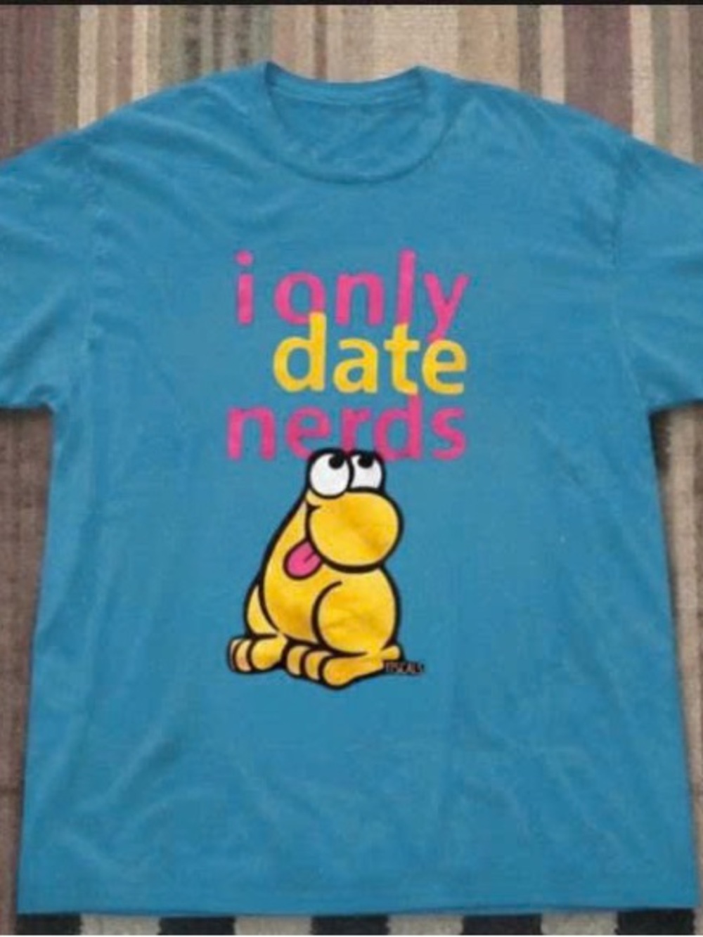 Blue Short-Sleeve Graphic Tee with Yellow Cartoon and Pink Text
